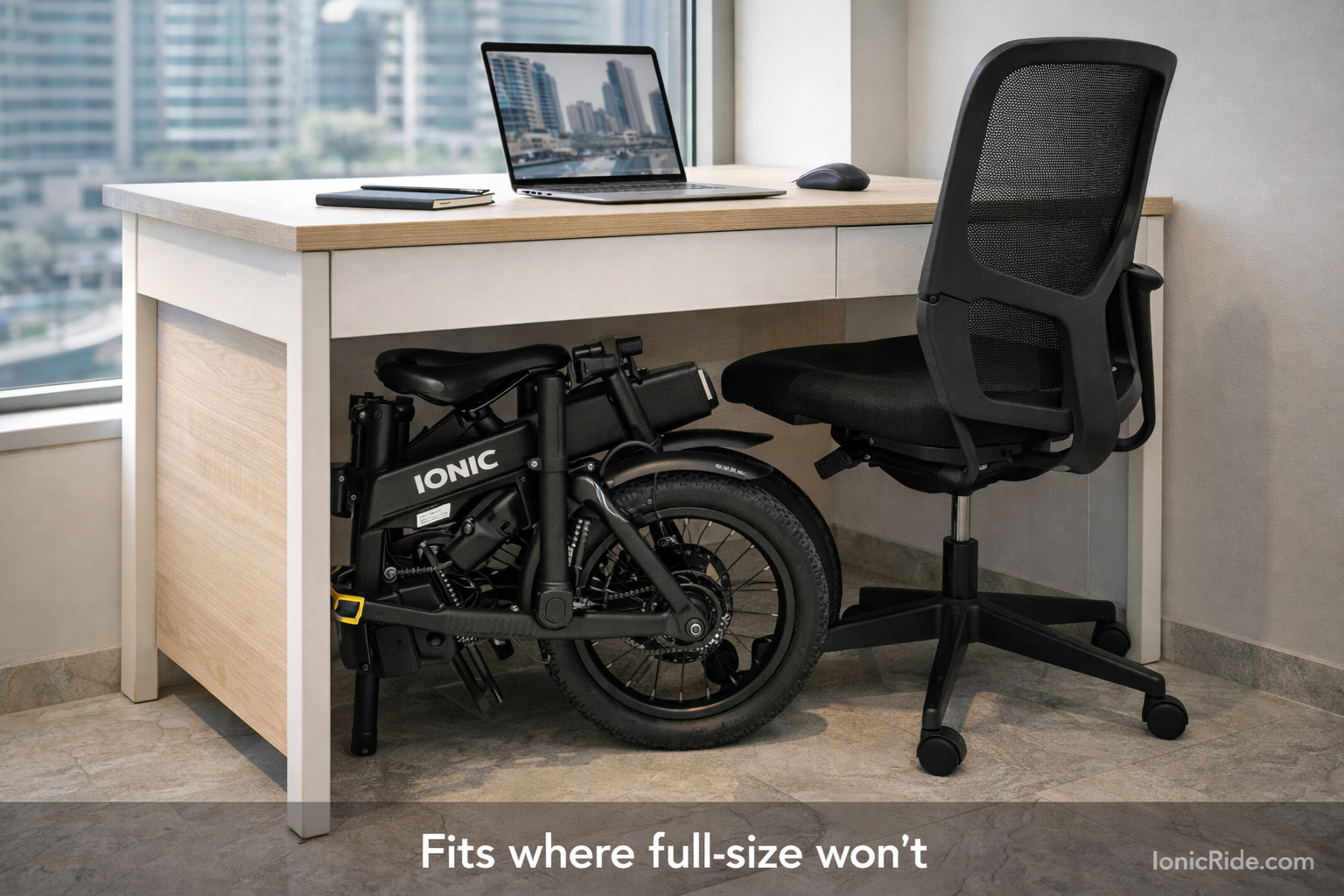 Folding e-bike stored under desk in Dubai apartment home office showing space-efficient storage solution