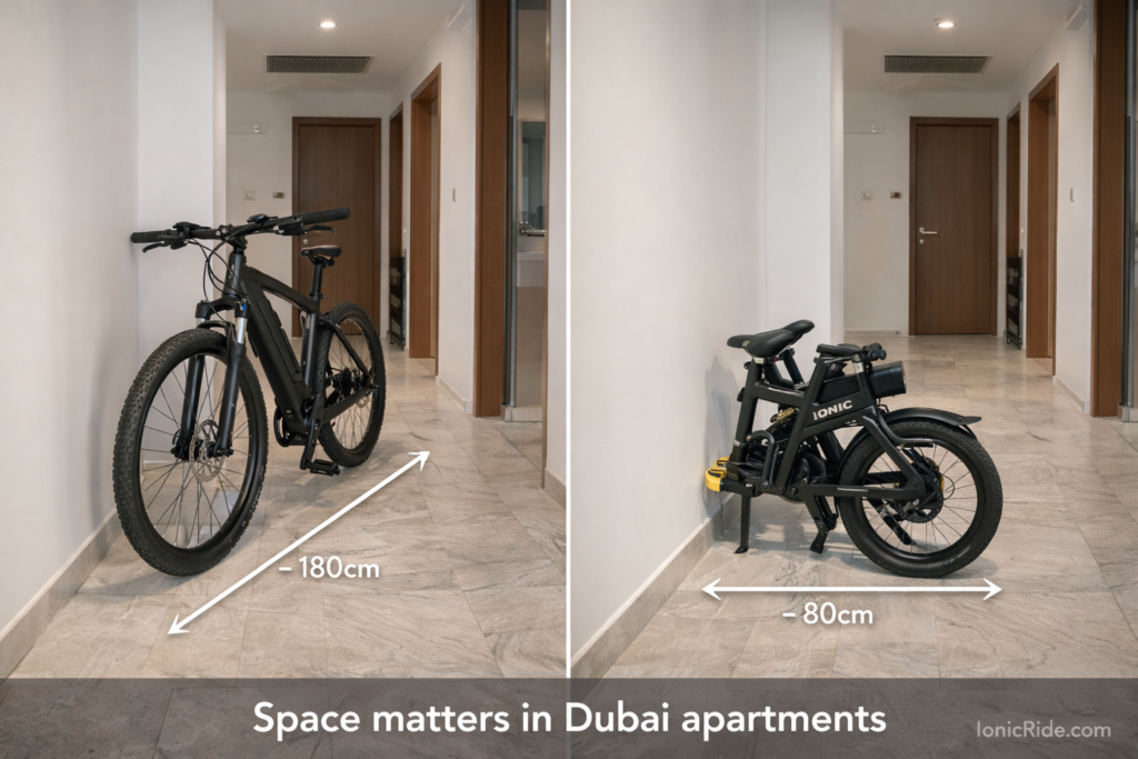 Side-by-side comparison of full-size e-bike versus folding e-bike in Dubai apartment hallway showing space difference