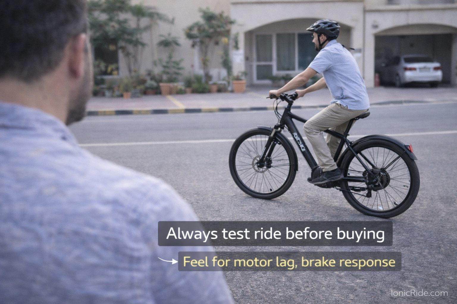 Test Riding Used E-Bike Before Buying Dubai Potential buyer test riding used e-bike in Dubai parking area checking motor response and brake performance before purchase